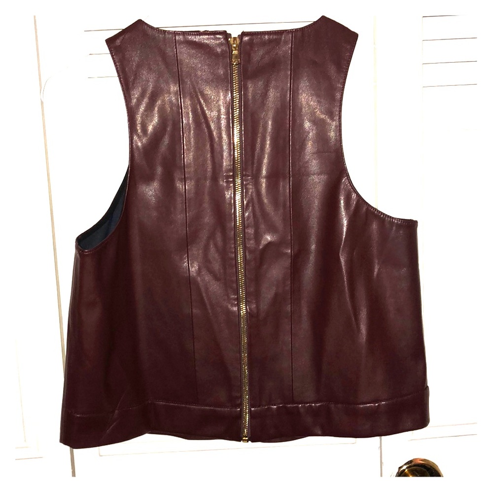 Maroon leather vest with gold zipper down the back